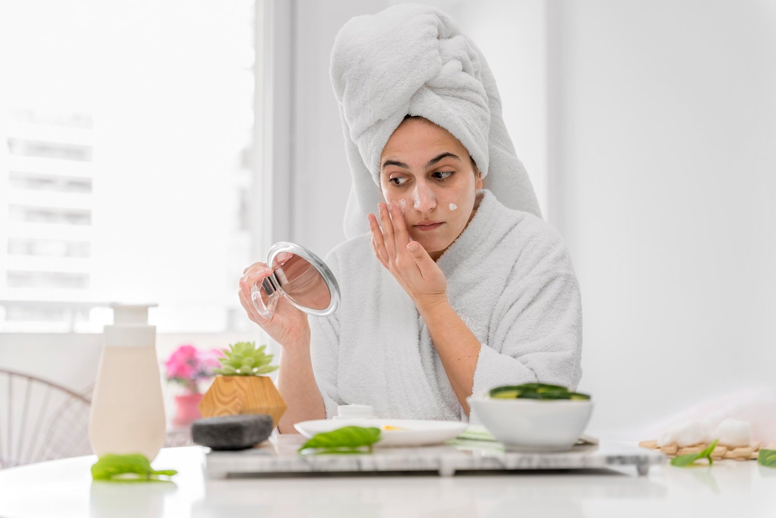 front view woman applying face cream